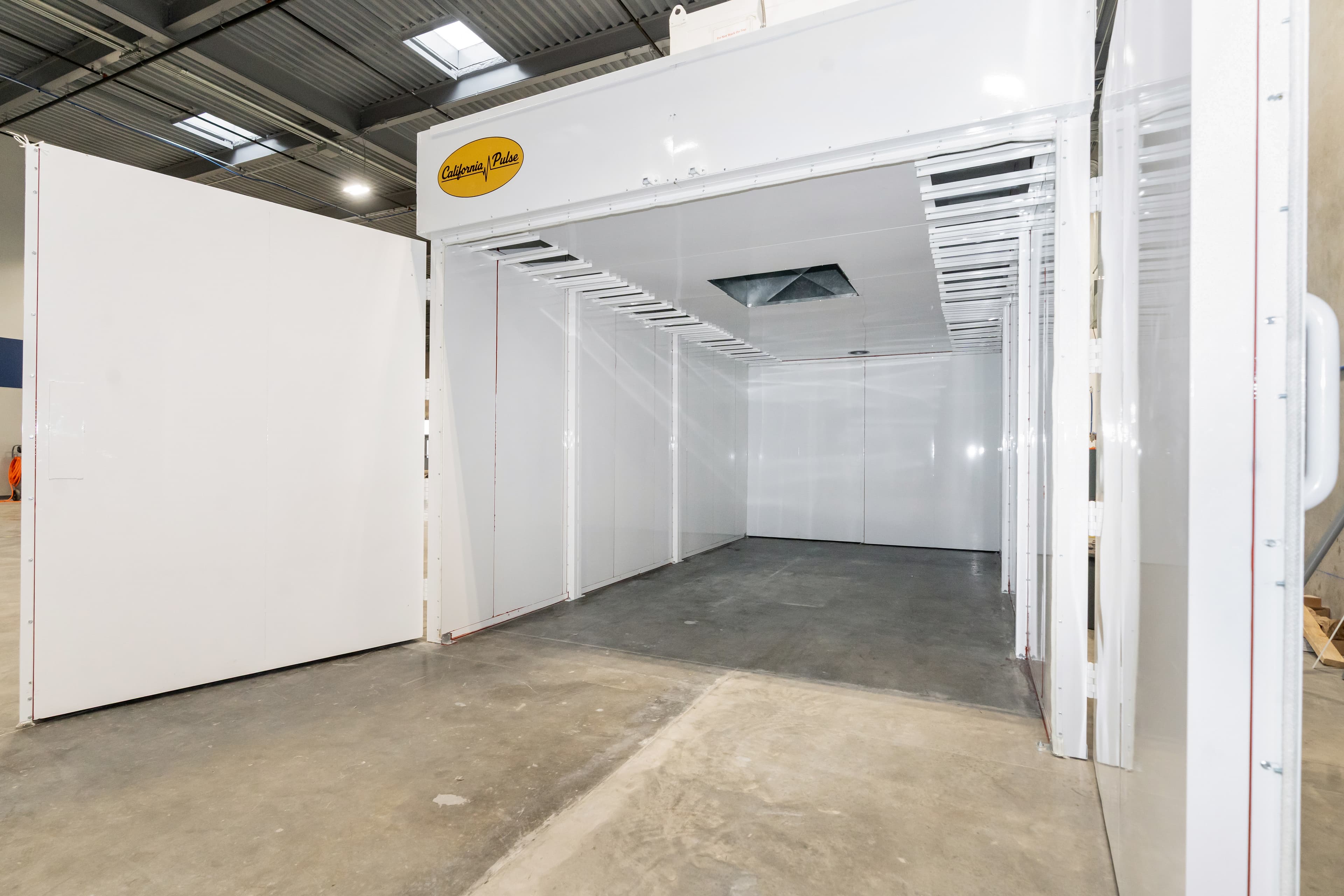 A powder coating booth tunnel