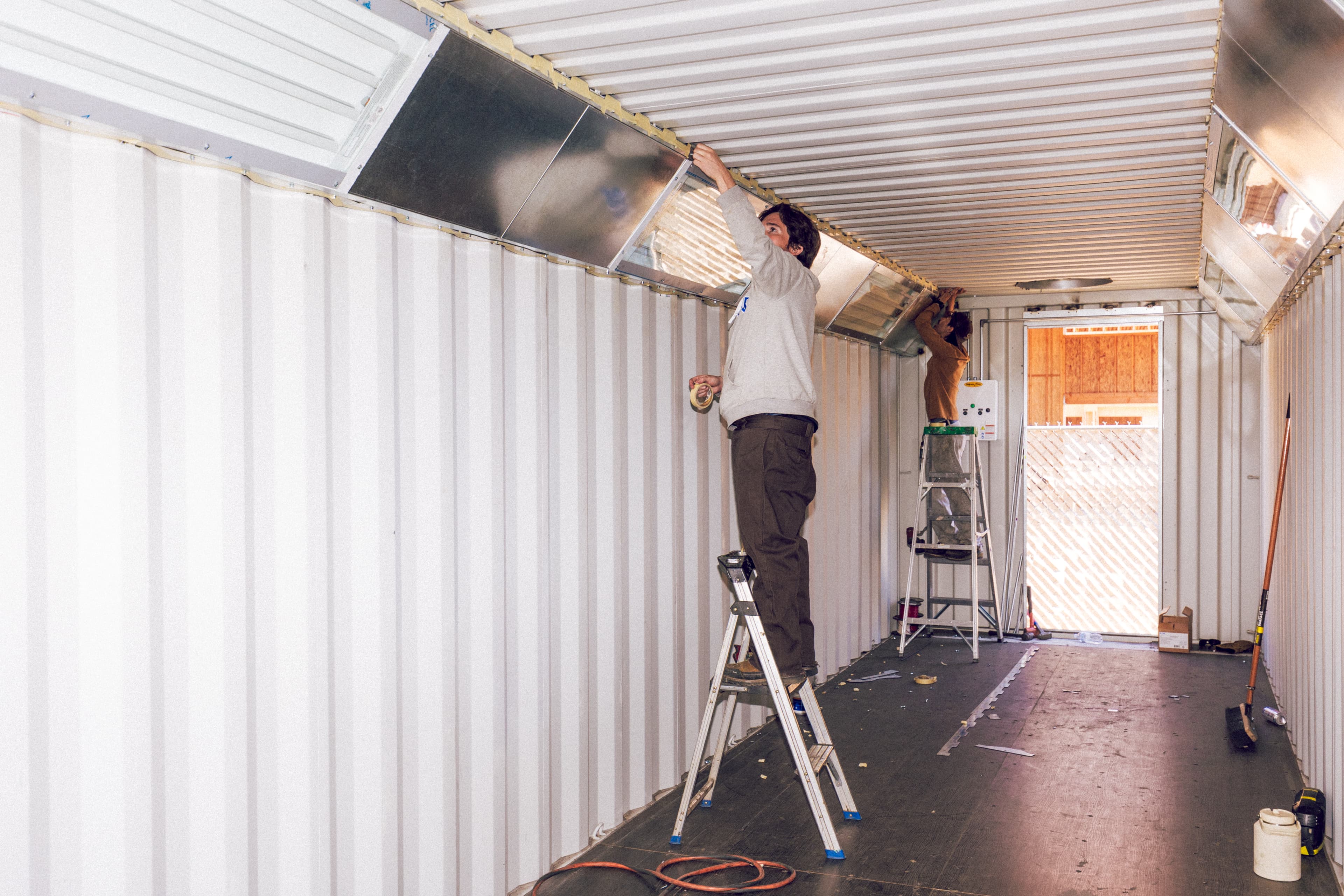 A California Pulse crew installing finishing equipment on site