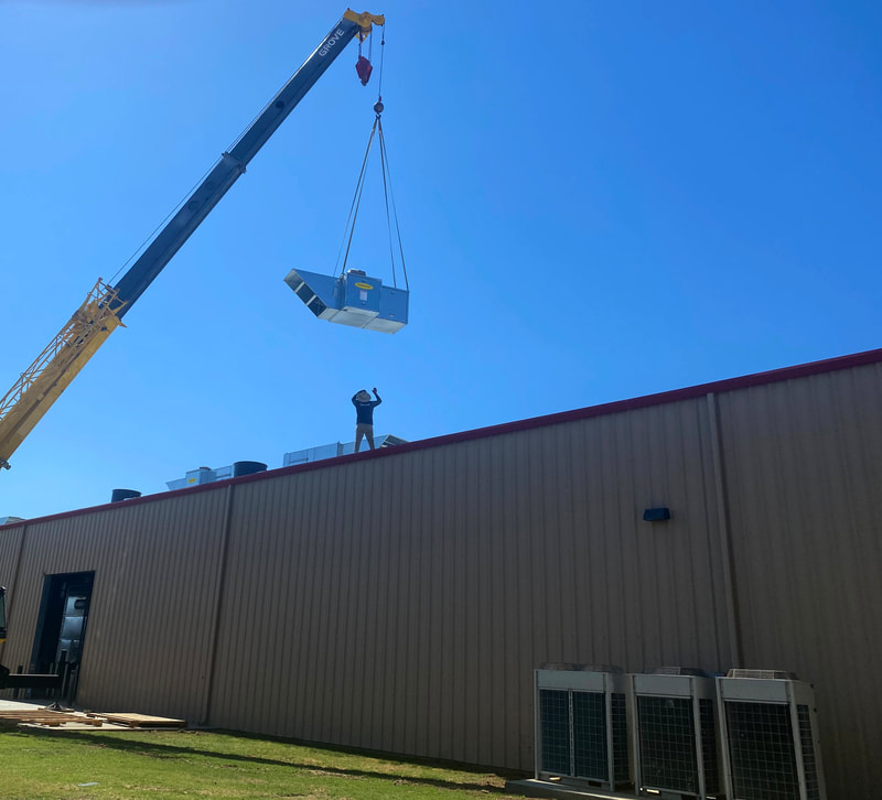 Roof installation of a spray booth heating system. 